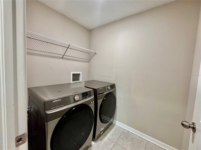 2612 E 26th Ave, Tampa, FL 33605 - laundry room featuring washing machine and clothes dryer and light tile patterned flooring