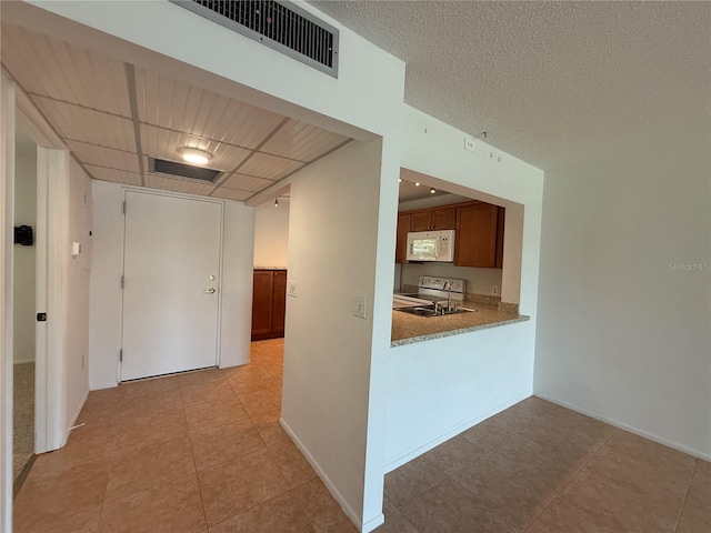12300 Vonn Rd Unit 9105, Largo, FL 33774 - hall with light tile patterned floors