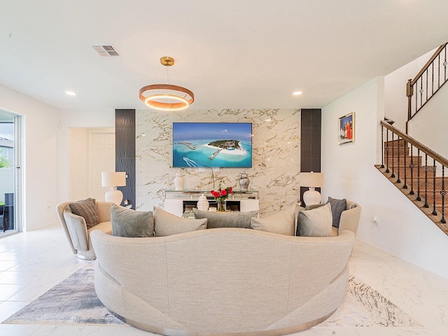 7700 Bronze Oak Dr, Wesley Chapel, FL 33545 - living room featuring marble tiled flooring, stairway, recessed lighting, and a fireplace