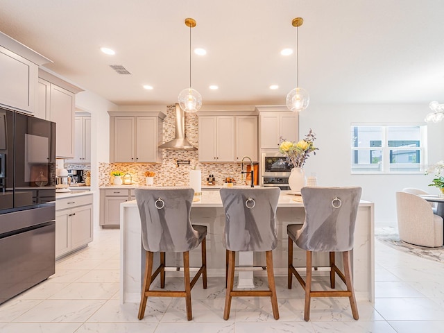 7700 Bronze Oak Dr, Wesley Chapel, FL 33545 - kitchen with wall chimney range hood, high quality fridge, built in microwave, light marble finish floors, and recessed lighting