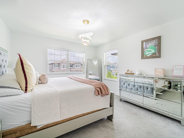7700 Bronze Oak Dr, Wesley Chapel, FL 33545 - bedroom featuring carpet flooring and a chandelier