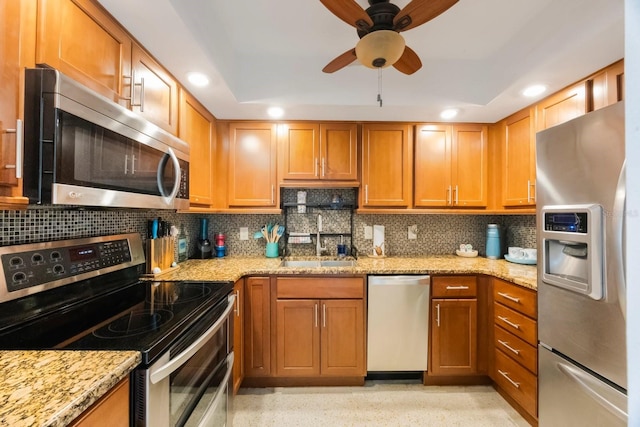 6161 Gulf Winds Dr Unit 347, St Pete Beach, FL 33706 - kitchen with appliances with stainless steel finishes, light stone counters, decorative backsplash, ceiling fan, and recessed lighting