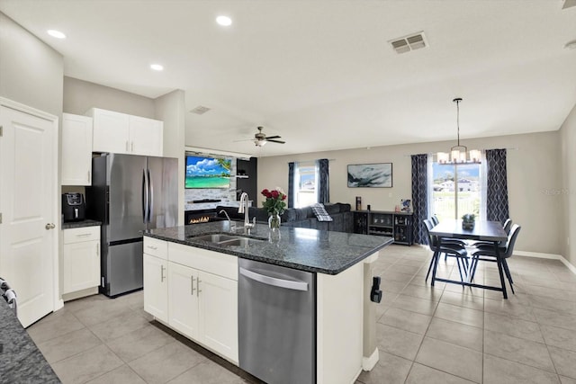12838 Wildflower Meadow Dr, Riverview, FL 33579 - kitchen featuring stainless steel appliances, a chandelier, white cabinets, light tile patterned flooring, and recessed lighting