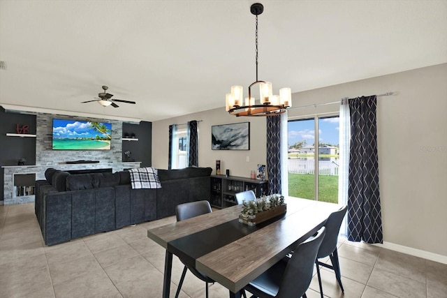 12838 Wildflower Meadow Dr, Riverview, FL 33579 - dining area with a chandelier, light tile patterned floors, and a ceiling fan