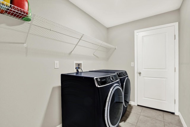 12838 Wildflower Meadow Dr, Riverview, FL 33579 - laundry room featuring separate washer and dryer and light tile patterned floors