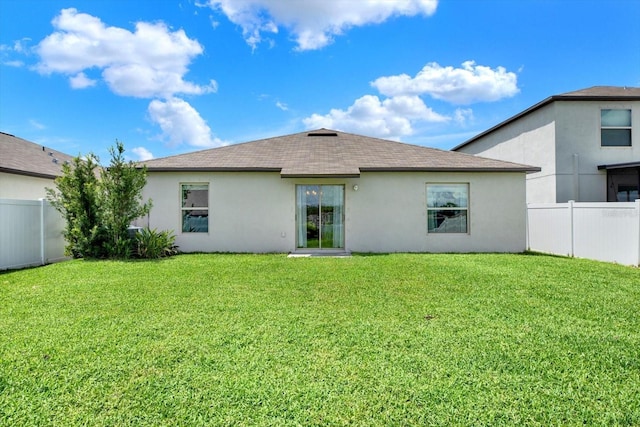 12838 Wildflower Meadow Dr, Riverview, FL 33579 - rear view of house with stucco siding and roof with shingles