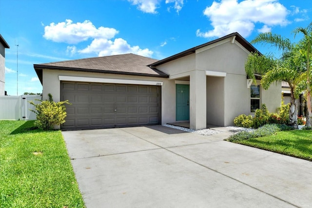 12838 Wildflower Meadow Dr, Riverview, FL 33579 - view of front of house with stucco siding, driveway, and an attached garage