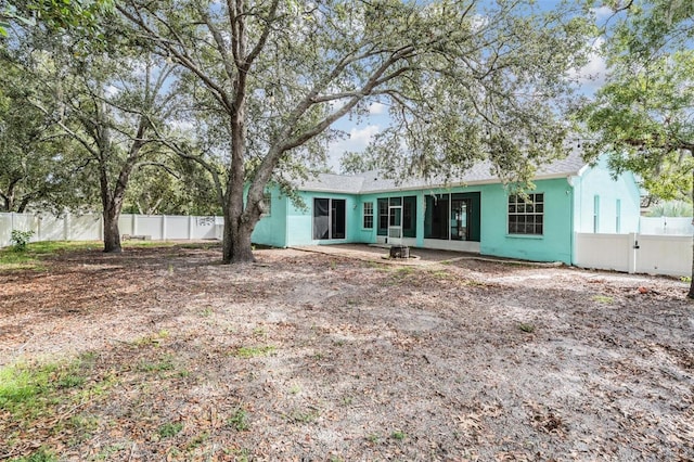 5283 Bevens Ave, Spring Hill, FL 34608 - back of house featuring a fenced backyard and stucco siding