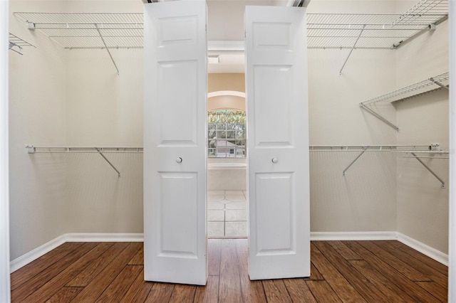 5283 Bevens Ave, Spring Hill, FL 34608 - walk in closet with wood finished floors