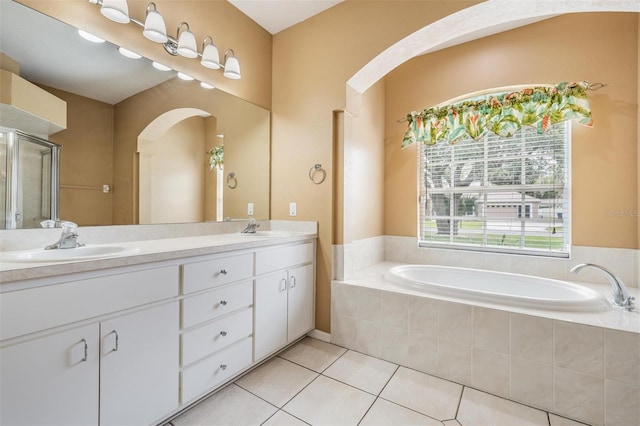 5283 Bevens Ave, Spring Hill, FL 34608 - full bath featuring double vanity, tile patterned floors, a bath, and a shower with shower door