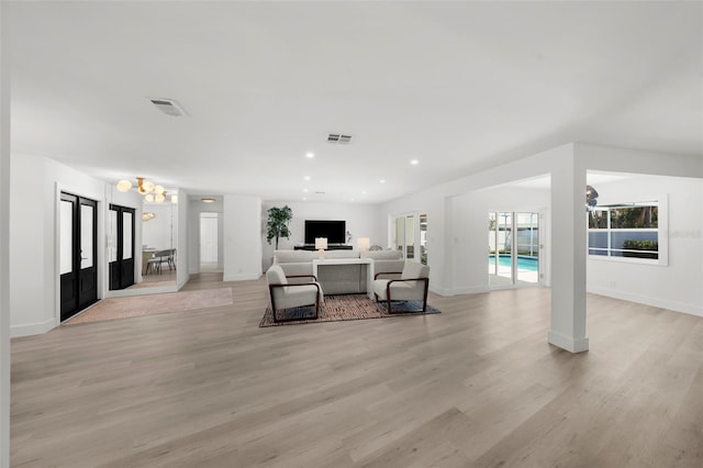 5884 51st St S, Saint Petersburg, FL 33715 - living area with plenty of natural light, light wood-type flooring, a chandelier, and recessed lighting