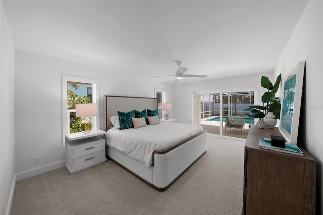 5884 51st St S, Saint Petersburg, FL 33715 - bedroom featuring access to outside, light colored carpet, and ceiling fan