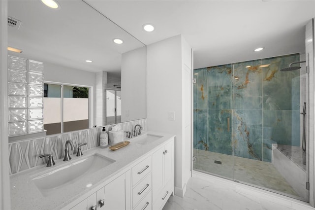 5884 51st St S, Saint Petersburg, FL 33715 - bathroom featuring recessed lighting, a marble finish shower, double vanity, marble finish flooring, and tasteful backsplash