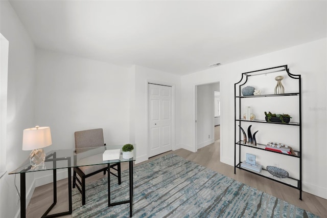 5884 51st St S, Saint Petersburg, FL 33715 - home office featuring wood finished floors and baseboards