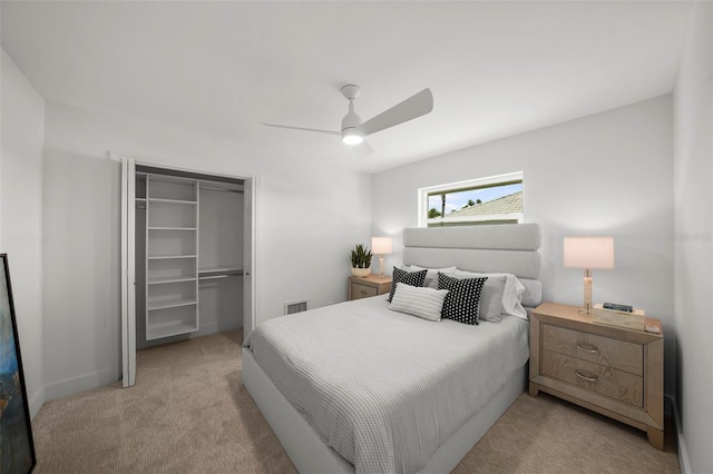 5884 51st St S, Saint Petersburg, FL 33715 - carpeted bedroom featuring a closet, ceiling fan, and a walk in closet