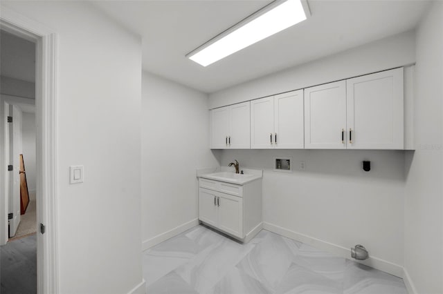 5884 51st St S, Saint Petersburg, FL 33715 - laundry room featuring washer hookup and cabinet space