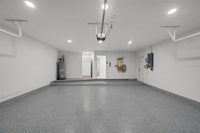 5884 51st St S, Saint Petersburg, FL 33715 - garage featuring electric panel, water heater, recessed lighting, and a garage door opener