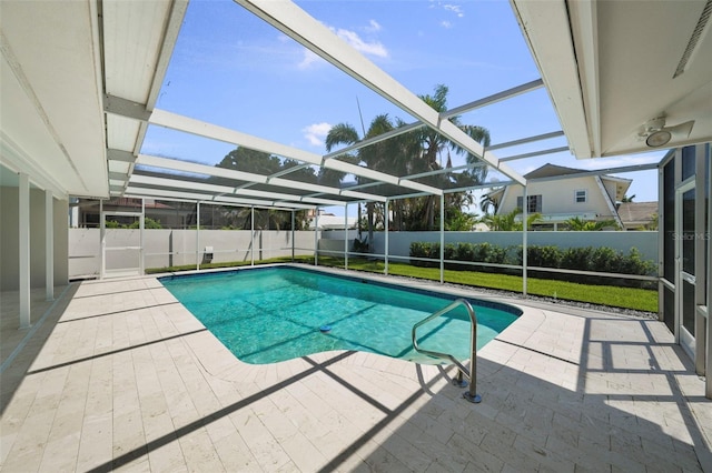 5884 51st St S, Saint Petersburg, FL 33715 - view of swimming pool featuring a patio area, a fenced backyard, and a lanai