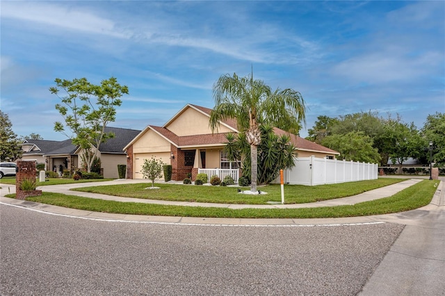 12337 Rose Haven Blvd, New Port Richey, FL 34654 - view of front of house featuring stucco siding, an attached garage, concrete driveway, and covered porch