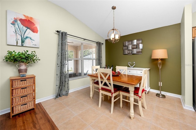 12337 Rose Haven Blvd, New Port Richey, FL 34654 - dining space featuring a chandelier and lofted ceiling