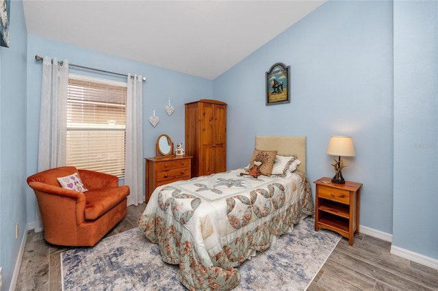 12337 Rose Haven Blvd, New Port Richey, FL 34654 - bedroom featuring vaulted ceiling and wood finished floors