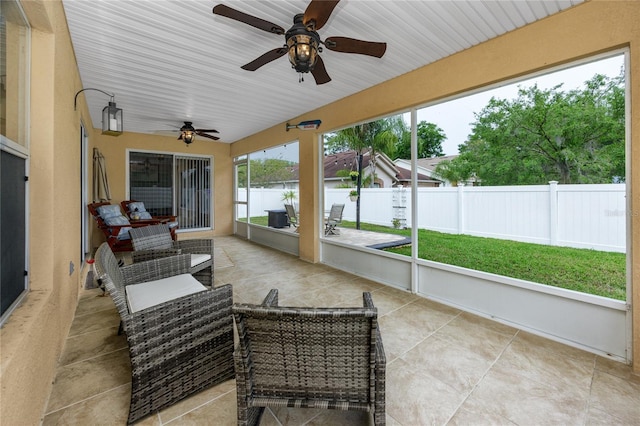 12337 Rose Haven Blvd, New Port Richey, FL 34654 - sunroom featuring a ceiling fan and outdoor lounge area