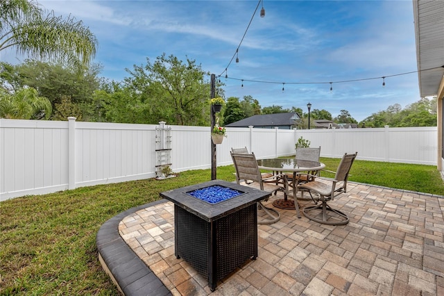 12337 Rose Haven Blvd, New Port Richey, FL 34654 - fenced backyard featuring a patio, outdoor dining space, and a fire pit
