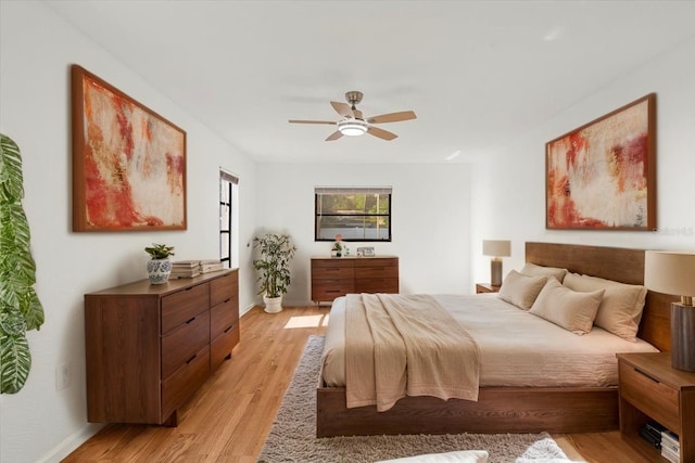 2233 Curlew Rd, Dunedin, FL 34698 - bedroom with light wood-style flooring and a ceiling fan