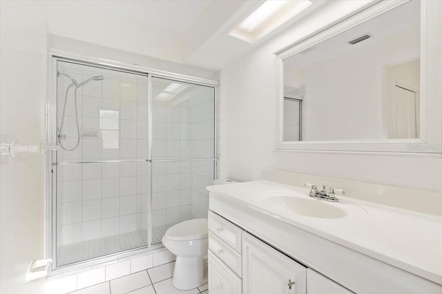 2233 Curlew Rd, Dunedin, FL 34698 - bathroom featuring vanity, a stall shower, and tile patterned flooring