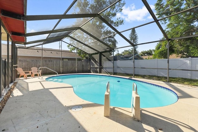 2233 Curlew Rd, Dunedin, FL 34698 - view of pool featuring a fenced backyard, a patio, and a lanai
