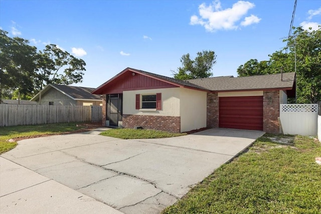 2233 Curlew Rd, Dunedin, FL 34698 - single story home with brick siding, driveway, and an attached garage