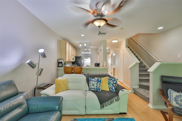 5717 Fishhawk Ridge Dr, Lithia, FL 33547 - living room with ceiling fan, light wood-style floors, stairway, and recessed lighting