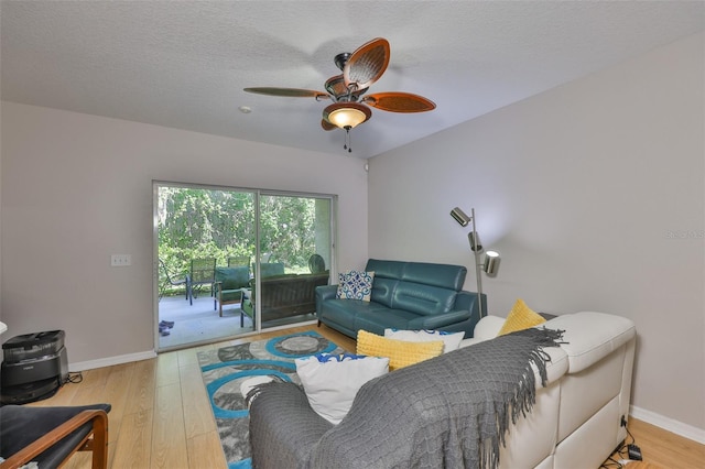 5717 Fishhawk Ridge Dr, Lithia, FL 33547 - living area featuring wood finished floors and a ceiling fan