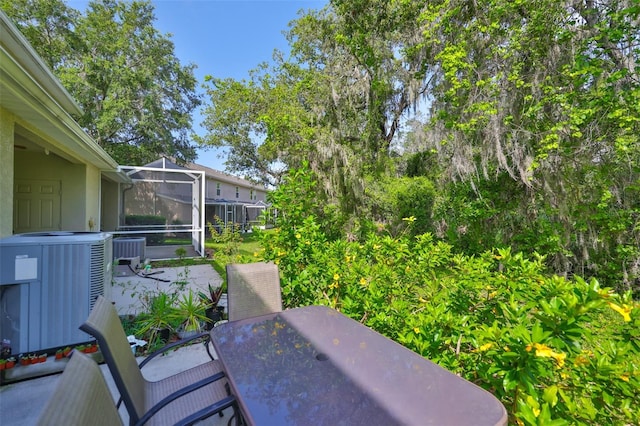 5717 Fishhawk Ridge Dr, Lithia, FL 33547 - view of patio / terrace featuring outdoor dining area and glass enclosure