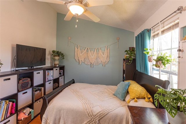 112 Sun Isle Cir Unit 112, Treasure Island, FL 33706 - bedroom featuring vaulted ceiling, a textured ceiling, and ceiling fan