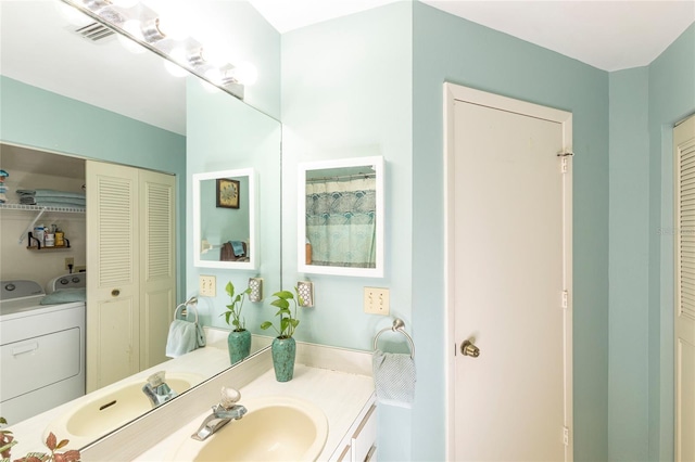 112 Sun Isle Cir Unit 112, Treasure Island, FL 33706 - bathroom with a closet, vanity, and separate washer and dryer