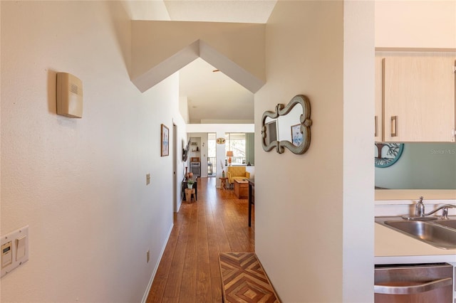112 Sun Isle Cir Unit 112, Treasure Island, FL 33706 - hallway featuring a sink and hardwood / wood-style floors