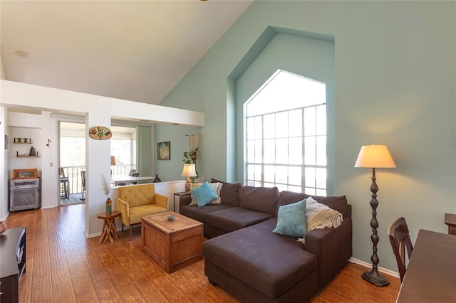 112 Sun Isle Cir Unit 112, Treasure Island, FL 33706 - living area with high vaulted ceiling and light wood finished floors