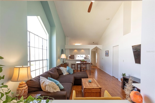 112 Sun Isle Cir Unit 112, Treasure Island, FL 33706 - living area with wood finished floors, high vaulted ceiling, and ceiling fan