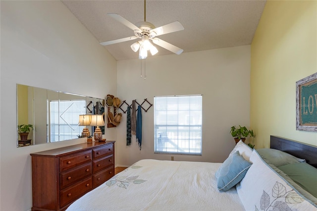 112 Sun Isle Cir Unit 112, Treasure Island, FL 33706 - bedroom featuring ceiling fan and high vaulted ceiling