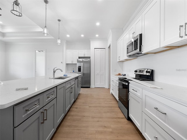 115 White Marsh Ln, Rotonda West, FL 33947 - kitchen with stainless steel appliances, ornamental molding, gray cabinets, white cabinetry, and recessed lighting