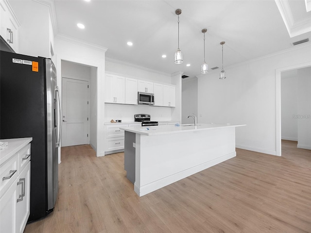 115 White Marsh Ln, Rotonda West, FL 33947 - kitchen with stainless steel appliances, recessed lighting, ornamental molding, light wood-style flooring, and light countertops