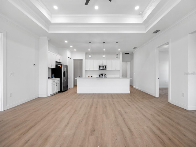 115 White Marsh Ln, Rotonda West, FL 33947 - unfurnished living room with a tray ceiling, light wood-type flooring, crown molding, a ceiling fan, and recessed lighting