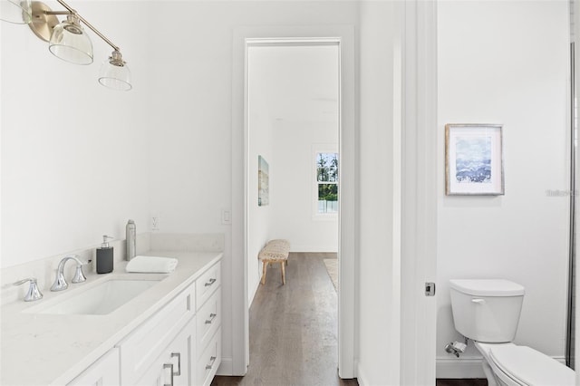 115 White Marsh Ln, Rotonda West, FL 33947 - bathroom with vanity and wood finished floors