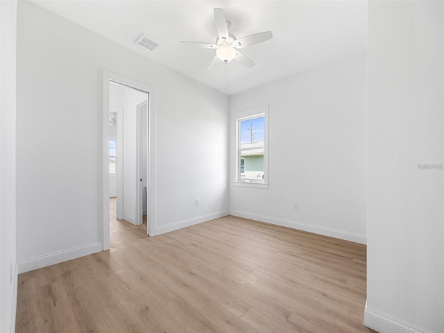 115 White Marsh Ln, Rotonda West, FL 33947 - unfurnished room featuring a ceiling fan and light wood finished floors