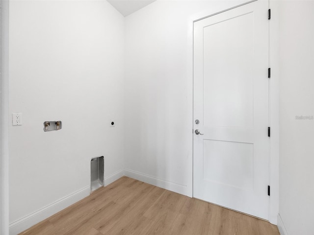 115 White Marsh Ln, Rotonda West, FL 33947 - laundry area featuring light wood finished floors, electric dryer hookup, and hookup for a washing machine