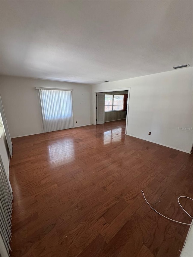 11423 77th Ave, Seminole, FL 33772 - empty room featuring wood finished floors