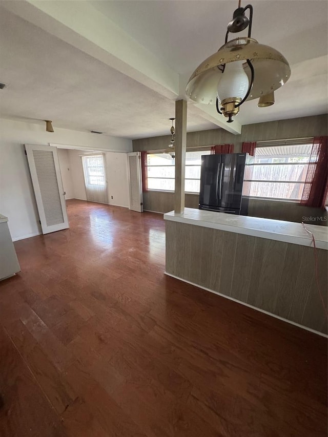 11423 77th Ave, Seminole, FL 33772 - kitchen with freestanding refrigerator and dark wood-type flooring