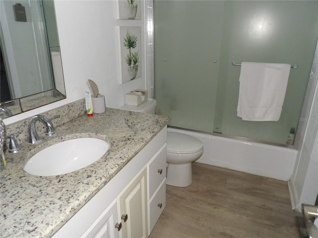 2617 Cove Cay Dr Unit 707, Clearwater, FL 33760 - bathroom featuring vanity, wood finished floors, and enclosed tub / shower combo