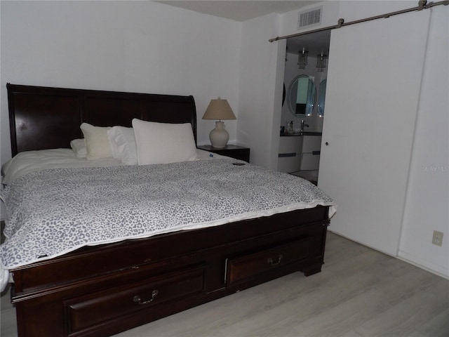 2617 Cove Cay Dr Unit 707, Clearwater, FL 33760 - bedroom featuring light wood finished floors
